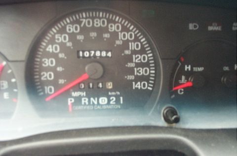 2001 Ford Crown Victoria - Dashboard gauges including speedometer, odometer, and temperature gauge are visible.