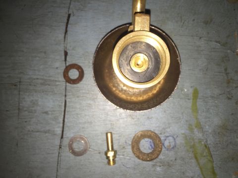 2014 Dodge 1500 - Brass valve fitting and washers laid out on a surface.