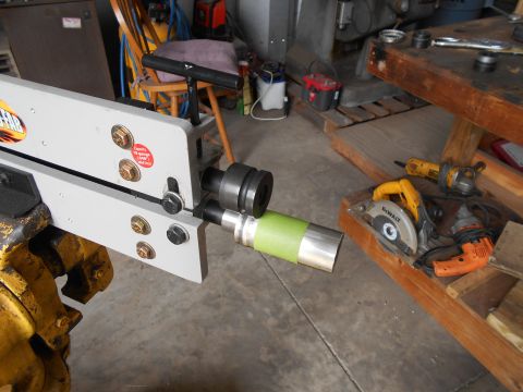 1992 Ford Bronco - A metal bending machine is shown with a piece of aluminum pipe wrapped in green tape.