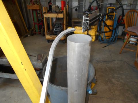 1992 Ford Bronco - Workshop scene with metal pipes, a rolling machine, and an air compressor.