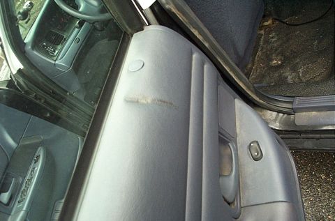 2001 Ford Crown Victoria - Interior view of a 2001 Ford Crown Victoria, showing the door panel and dashboard details.