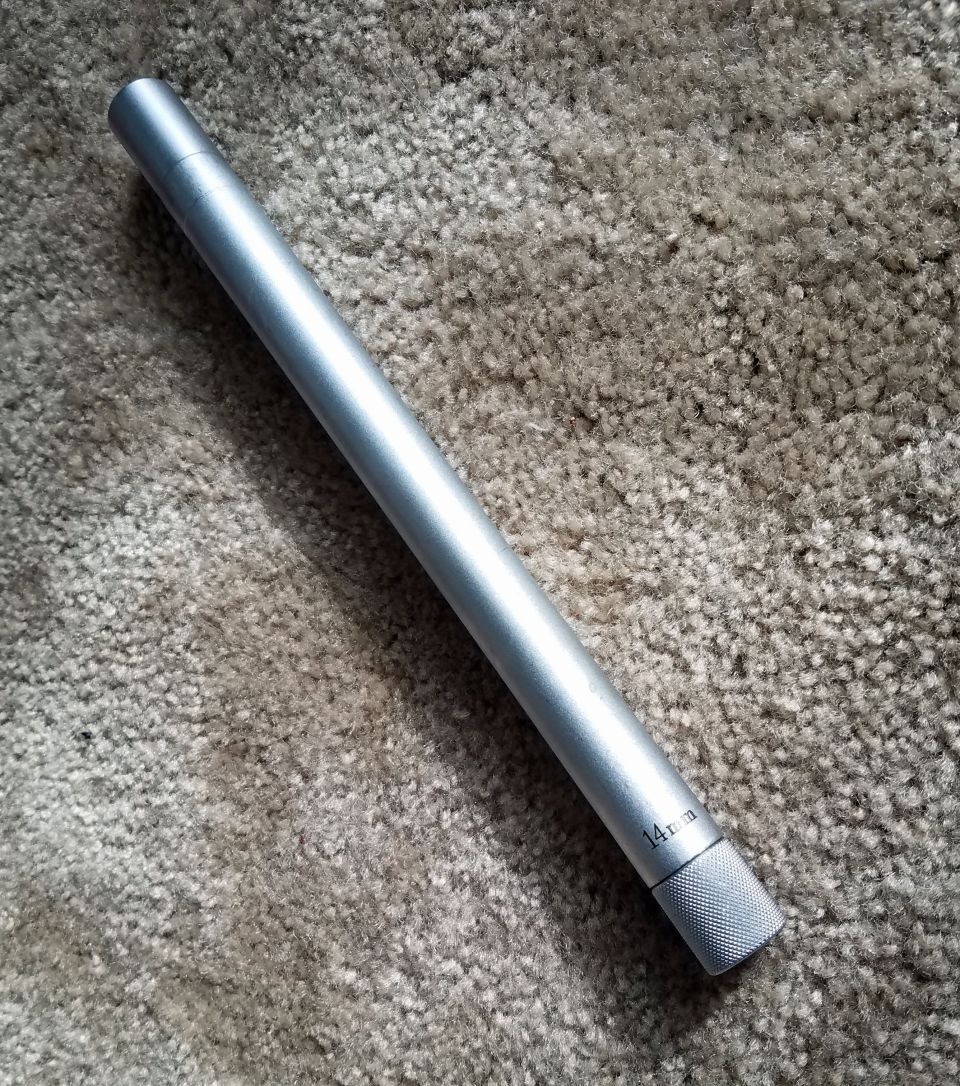 Silver 14mm socket extension on carpet