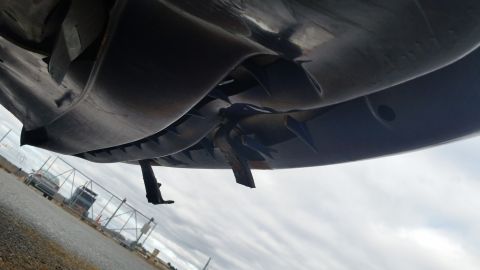 1991 Ford LTD Crown Victoria - Underside view of a vehicle, focusing on suspension components and undercarriage shielding.