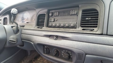 1991 Ford LTD Crown Victoria - The dusty interior of a car, the dashboard and center console.