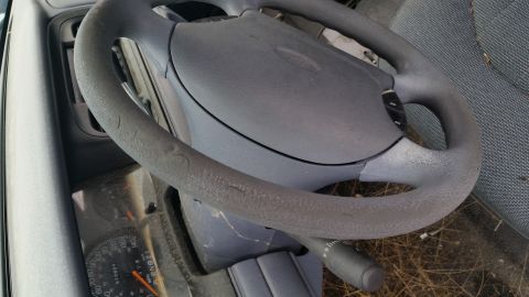 1991 Ford LTD Crown Victoria - Interior view of a 1991 Ford Crown Victoria LTD, focusing on the steering wheel and dashboard.