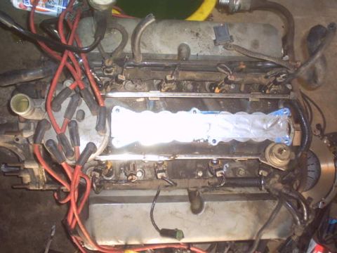 1991 Ford Crown Victoria - Engine part with spark plug wires and distributor cap visible.