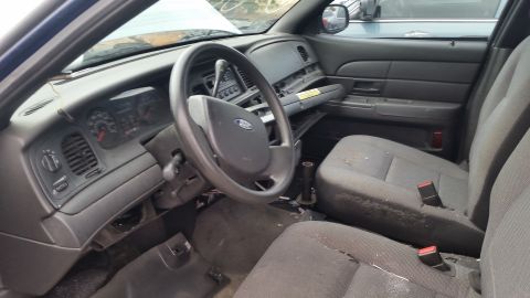 1991 Ford LTD Crown Victoria - The interior of a Ford Crown Victoria shows the dashboard, steering wheel, and front seats.