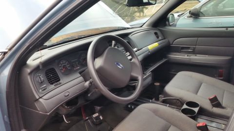 1991 Ford LTD Crown Victoria - Interior view of a 1991 Ford Crown Victoria, highlighting the dashboard and seating area.