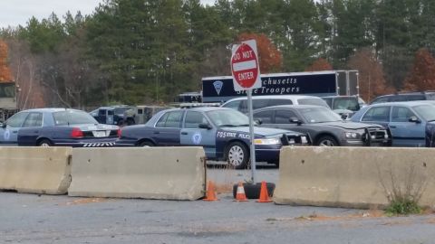 1991 Ford LTD Crown Victoria - Massachusetts State Police vehicles are parked in a lot, with a "Do Not Enter" sign visible.