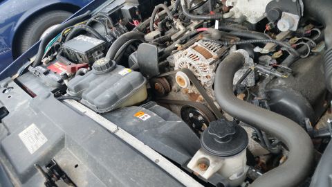 1991 Ford LTD Crown Victoria - Close-up view of a car's engine bay with visible engine components and wiring.