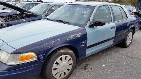 1991 Ford LTD Crown Victoria - This Ford Crown Victoria has been repainted with different shades of blue on its body panels.
