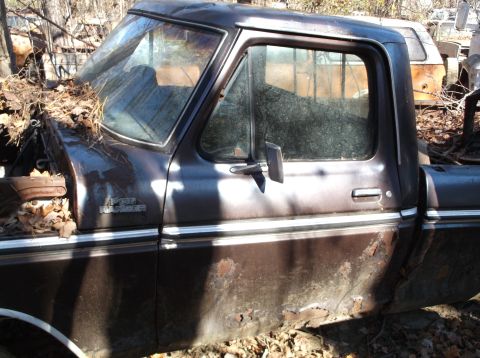1974 Dodge Challenger - This 1975 Ford F-150 Ranger pickup truck is in poor condition, with significant rust and debris.