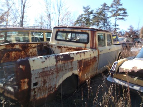 1974 Dodge Challenger - Junkyard scene with heavily rusted pickup truck and station wagon.