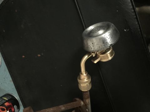2014 Dodge 1500 - A close-up shows a propane torch adapter with brass fittings against a dark background. A SuperMotors logo is visible at the bottom right.
