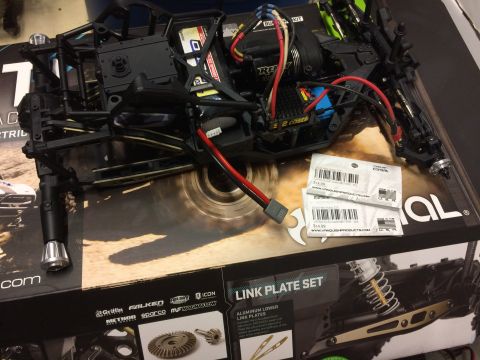 1989 Ford Bronco - The chassis of a remote control car, showing its internal components and some new parts.