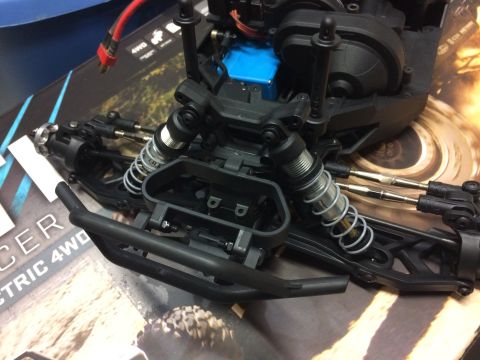 1989 Ford Bronco - Close-up of an RC car's front chassis, showing suspension and electronic parts.