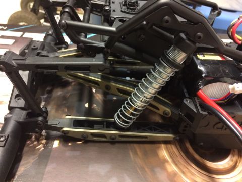1989 Ford Bronco - The intricate suspension components of a remote-controlled vehicle are visible in this detailed shot.