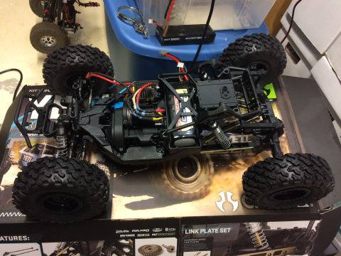 1989 Ford Bronco - This is a remote-controlled car chassis, not a 1989 Ford Bronco. Another RC car is visible in the background.