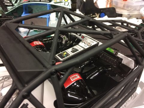 1989 Ford Bronco - Close-up of a model car's interior, showing intricate details of the dashboard and roll cage structure.