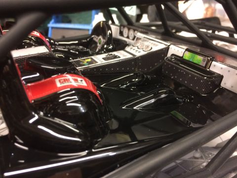 1989 Ford Bronco - The interior of a custom off-road vehicle features racing seats and a detailed dashboard with multiple gauges.