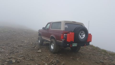 1996 Ford Bronco - 1996 Ford Bronco equipped for off-road adventure, seen in foggy conditions.