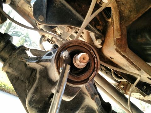 1992 Ford Bronco - After hammering around the edges of the old seal with a screwdriver, I was able to bend it in enough and then used a hook style seal remove…