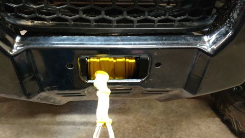 2016 Honda TRX 90 - A yellow winch is visible on the front of a vehicle.