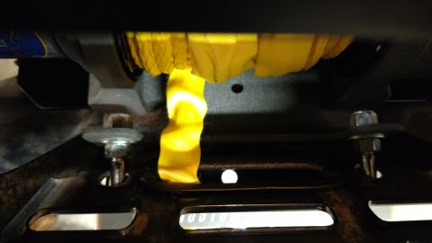 2016 Honda TRX 90 - Close-up of a winch drum and yellow strap, likely part of an ATV or similar vehicle.