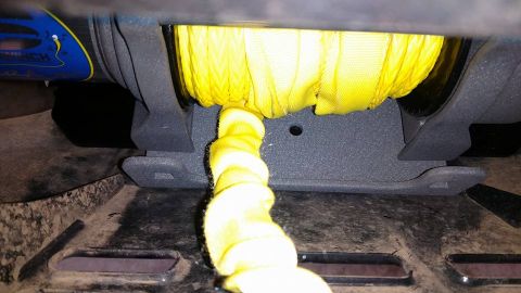2016 Honda TRX 90 - Close-up view of a winch mechanism with a yellow strap.