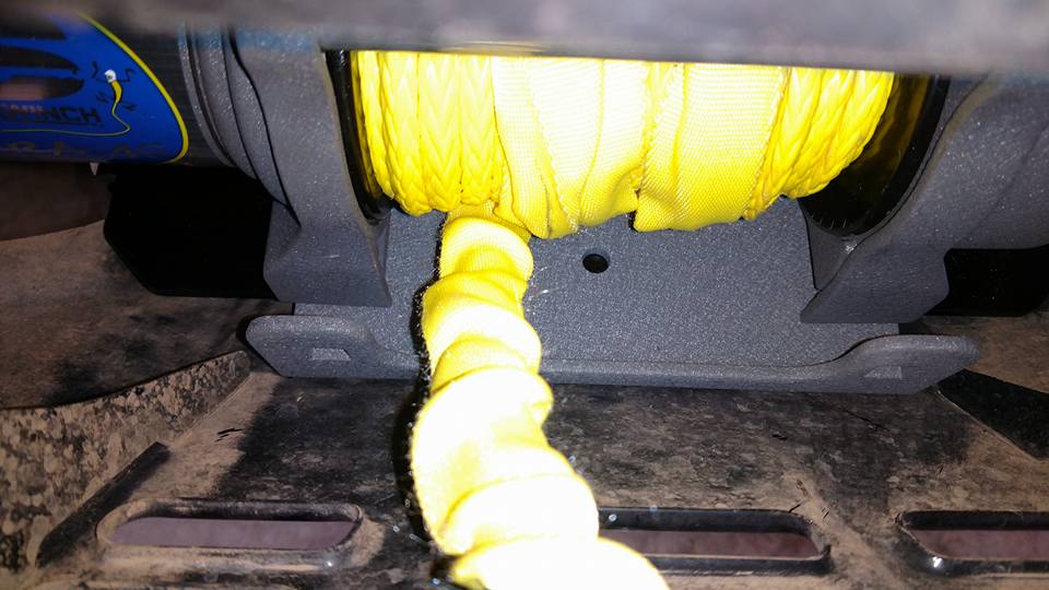 Winch with yellow strap coiled and feeding out
