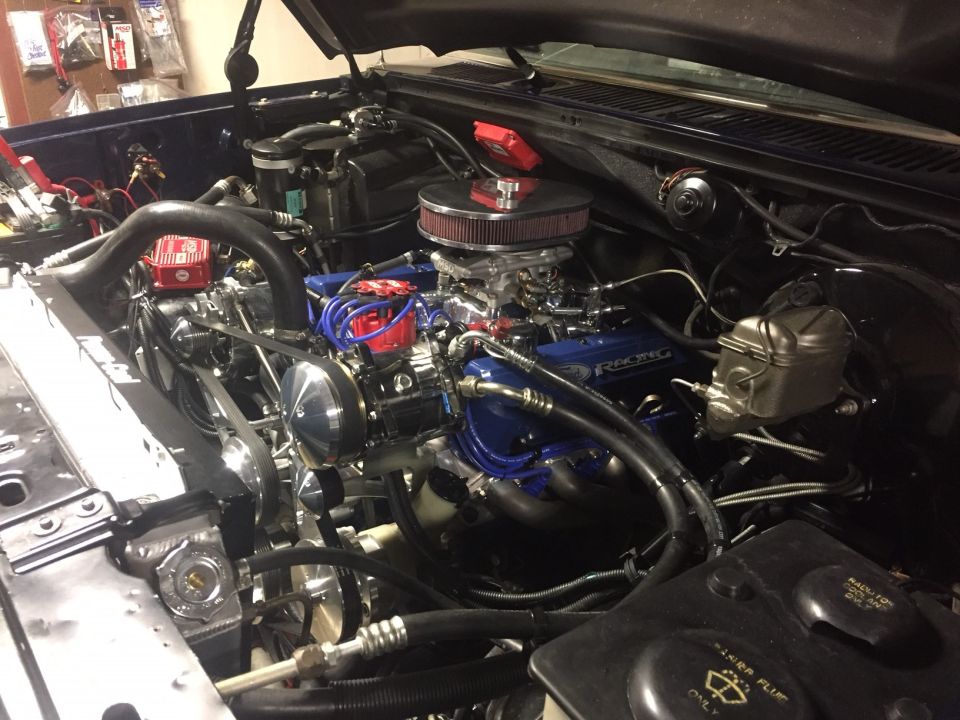 Engine bay with blue Ford Racing valve covers, chrome air cleaner, and aftermarket distributor