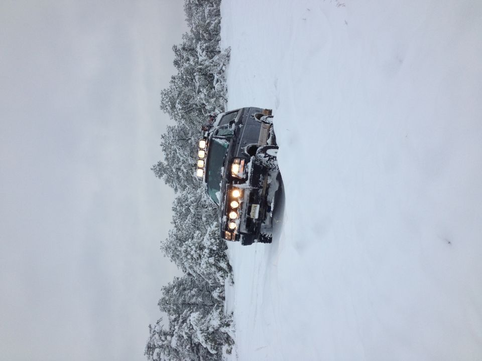 1996 Ford Bronco with light bar in snow