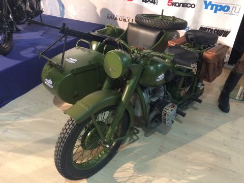 1987 Ford Bronco - This military motorcycle with sidecar and machine gun appears to be on display at an event.