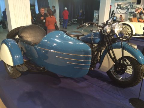 1987 Ford Bronco - A vintage blue motorcycle is displayed with its sidecar attachment.