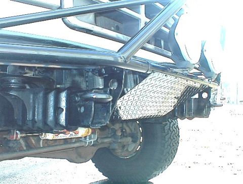 1995 Ford Bronco - This photo focuses on the undercarriage and suspension system of a modified off-road vehicle.