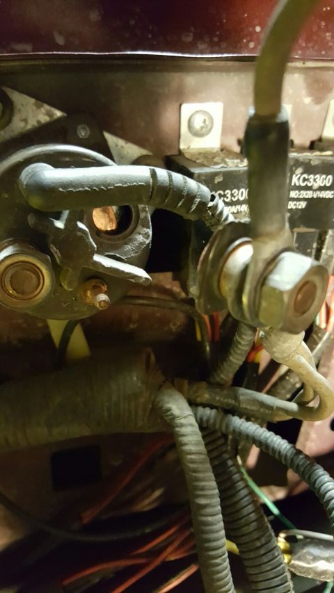 1996 Ford Bronco - A close-up view shows electrical components, including a relay labeled "KC3300" and several thick wires connected by a large nut and bolt.…