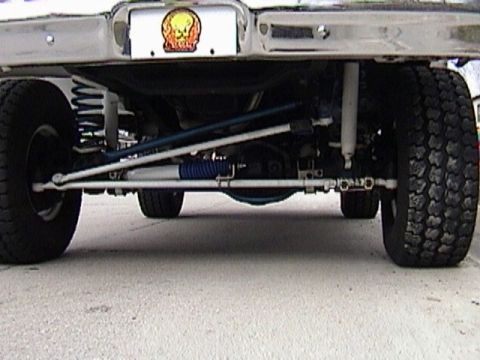 1995 Ford Bronco - Custom suspension components visible on the underside of a vehicle.
