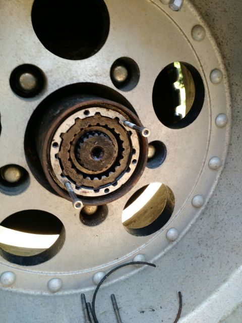 1992 Ford Bronco - now use a couple of your bolts to pull the lockout body free from the hub..it should slide right out.