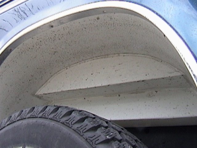 Blue 1995 Ford Bronco rear wheel well