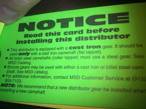 1982 Ford Bronco - A bright green card with black text provides instructions and warnings about installing a distributor. The text includes a notice, installa…