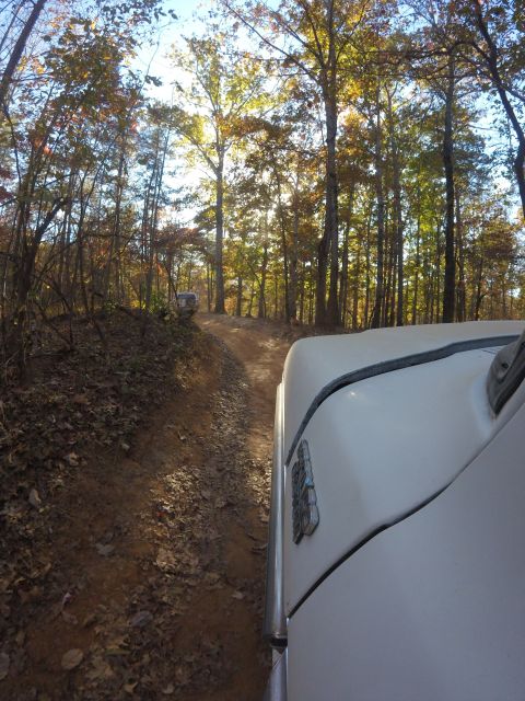 1979 Ford Bronco - Driving a 1979 Ford Bronco on a wooded trail with another vehicle in sight.