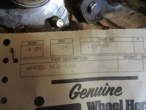 1986 Yamaha BLASTER - A close-up view of a wheel hub part with a label indicating its description and part number.