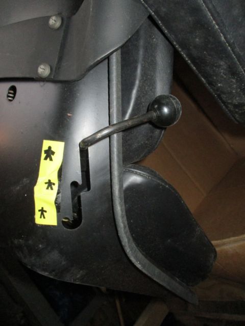 1986 Yamaha BLASTER - A black lever with a round knob is visible, along with yellow stickers depicting stick figures.