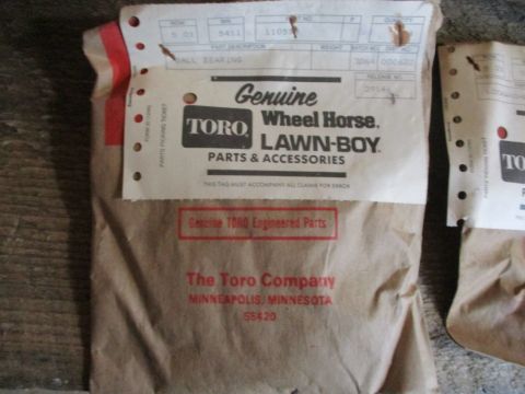 1986 Yamaha BLASTER - Genuine Toro Engineered Parts are packaged in brown paper with detailed labels from The Toro Company.
