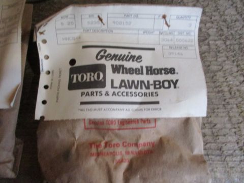 1986 Yamaha BLASTER - A parts tag for Toro Wheel Horse Lawn-Boy parts and accessories is shown, with part number 900152 visible.