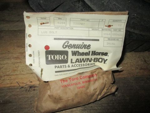 1986 Yamaha BLASTER - A lug bolt part is shown with its associated Toro Wheel Horse Lawn-Boy documentation.