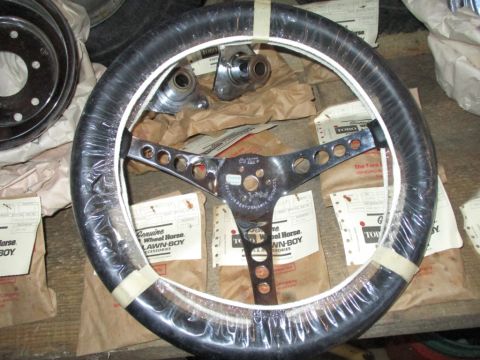 1986 Yamaha BLASTER - A chrome steering wheel with a black grip, packaged with "Genuine Wheel Horse Lawn-Boy Accessories" labels.