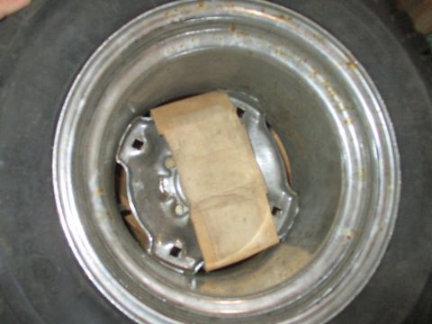 1986 Yamaha BLASTER - Close-up view of a wheel hub, partially covered by a piece of tan paper.