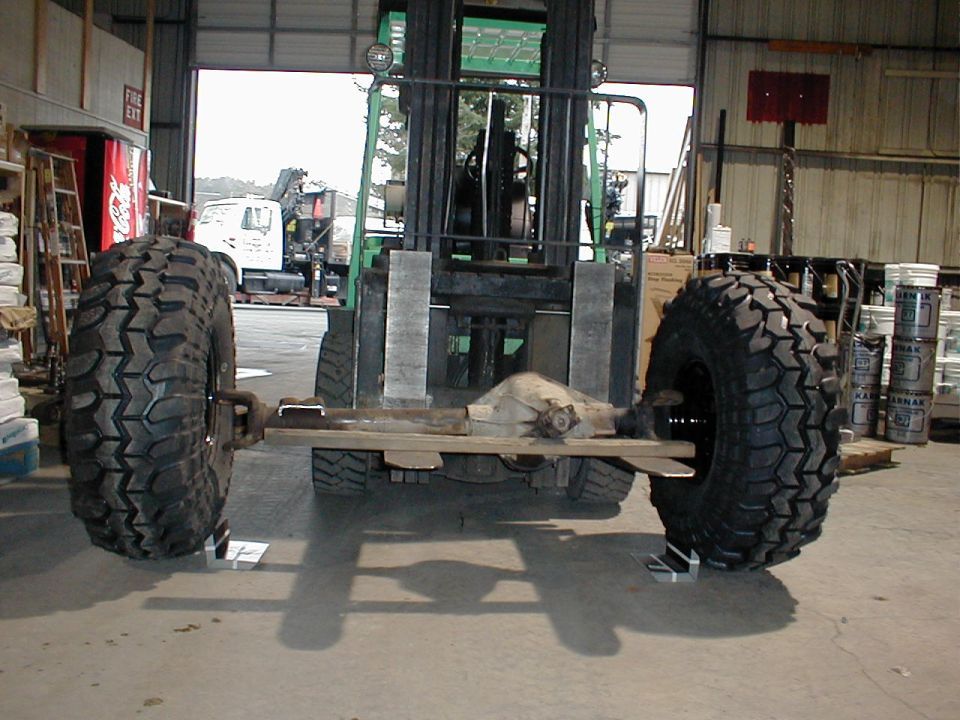 Rear axle with large off-road tires on a forklift
