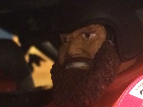 1989 Ford Bronco - A toy figure with a beard and helmet is visible inside a vehicle.